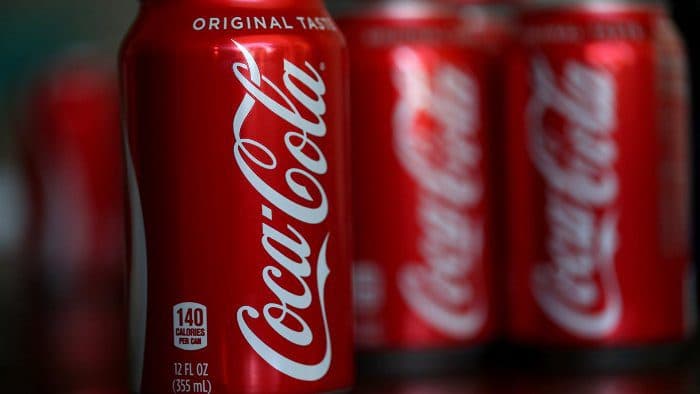 Coca-Cola to cut , jobs globally